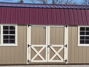 Model 10114 12 x 24 Buckskin with Navajo White Trim & Burgandy Metal Roof Lofted Garden Shed