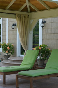 Pavilion with curtains and lounge chairs