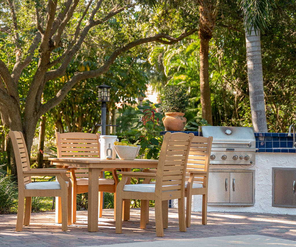 Dining set with outdoor kitchen and grill