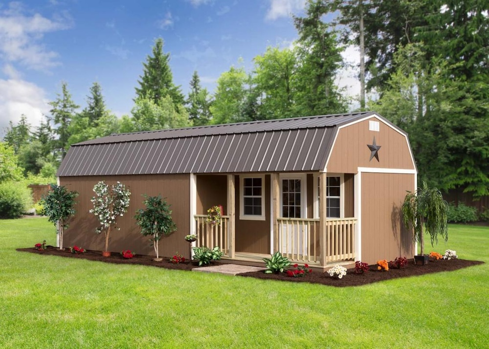 tan storage shed with custom porch by millers mini barns