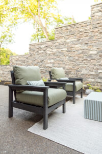 Camden Club Chairs, Camden End Table, and in Smoke Gray. Cushions in Heritage Leaf. Lumbar pillows and LilyHive Rectangular Pouf in Sail Away