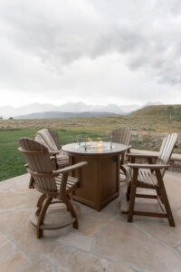 Comfo Counter Chairs Chairs in Weatherwood on Antique Mahogany. Donoma 44 Round Fire Table in Antique Mahogany with Bronze Hammered Top