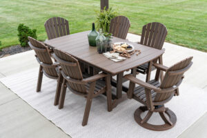 Garden Classic 44” x 72” Rectangular Dining Table in Brazilian Walnut. Comfo Back Dining Chairs and Comfo Back Swivel Rocker Dining Chairs in Brazilian Walnut