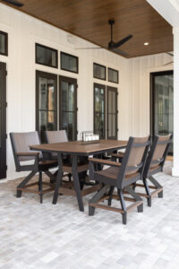 Harbor 44” x 72” Rectangular Counter Table in Brazilian Walnut on Black. Mayhew Chat Swivel Counter Chairs in Brazilian Walnut on Black (2)