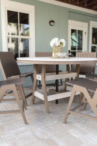 Harbor 60” Round Counter Table in Seashell on Weatherwood paired with Kinsley Counter Side Chairs in Clay