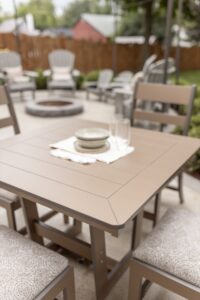 Hudson 40” Square Dining Table in Clay with Parker Chairs. Seat cushions in La La Land Sand