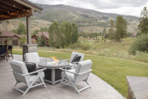 Kinsley Lounge Chairs in Fog. Donoma Round Fire Pit in Smoke Gray on Light Gray
