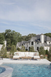 Mayhew Sectional, End Tables, and Coffee Table in Weatherwood. Cushions in Improve White