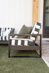 Nordic High Back Loveseat in Matte Black. Cushions in Galleon Ebony with throw pillows in Cast Sage, Canvas Natural
