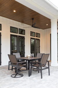 Vida 44 Square Poly Dining Table and Vida Dining Poly Chairs and Dining Swivel Rockers in Brazilian Walnut on Black 3