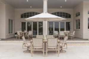 Vida 44” x 73” Poly Dining Table in Sahara Speckle and Seashell poly. Vida Poly Swivel Rocker Poly Dining Chairs and Vida Poly Dining Chairs in Sahara Speckle and Seashell poly 5